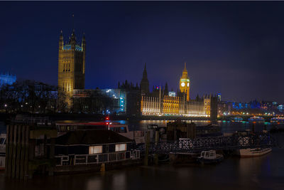 Illuminated buildings in city at night