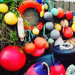 Close-up of colorful buoys on wall