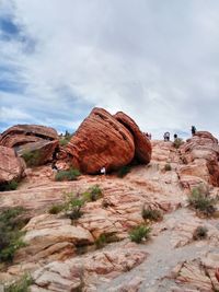 Low angle view of rock formation on landscape against sky