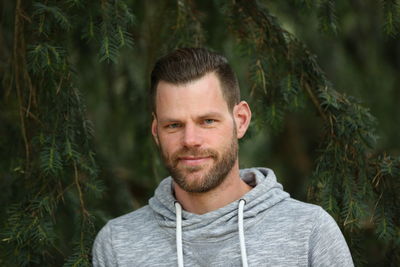 Portrait of young man in forest