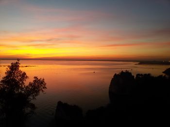 Scenic view of sea against sky at sunset