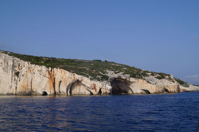 Scenic view of sea against clear blue sky