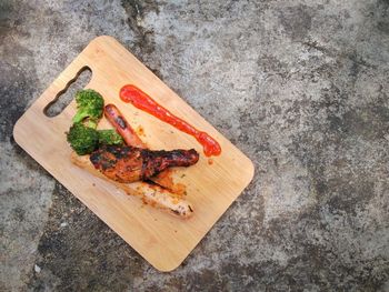 High angle view of fish on cutting board