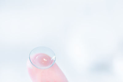 Close-up of hand holding glass