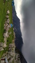 Scenic view of mountain against cloudy sky