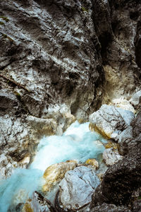 Low angle view of rocks in water