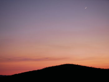 Scenic view of silhouette trees against sky during sunset