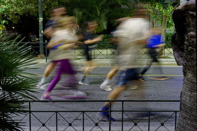 Rear view of woman standing in playground