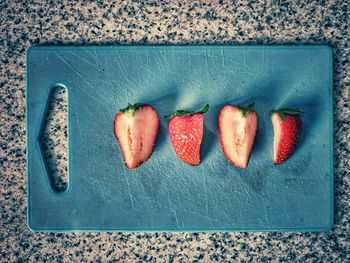 High angle view of fruits on cutting board