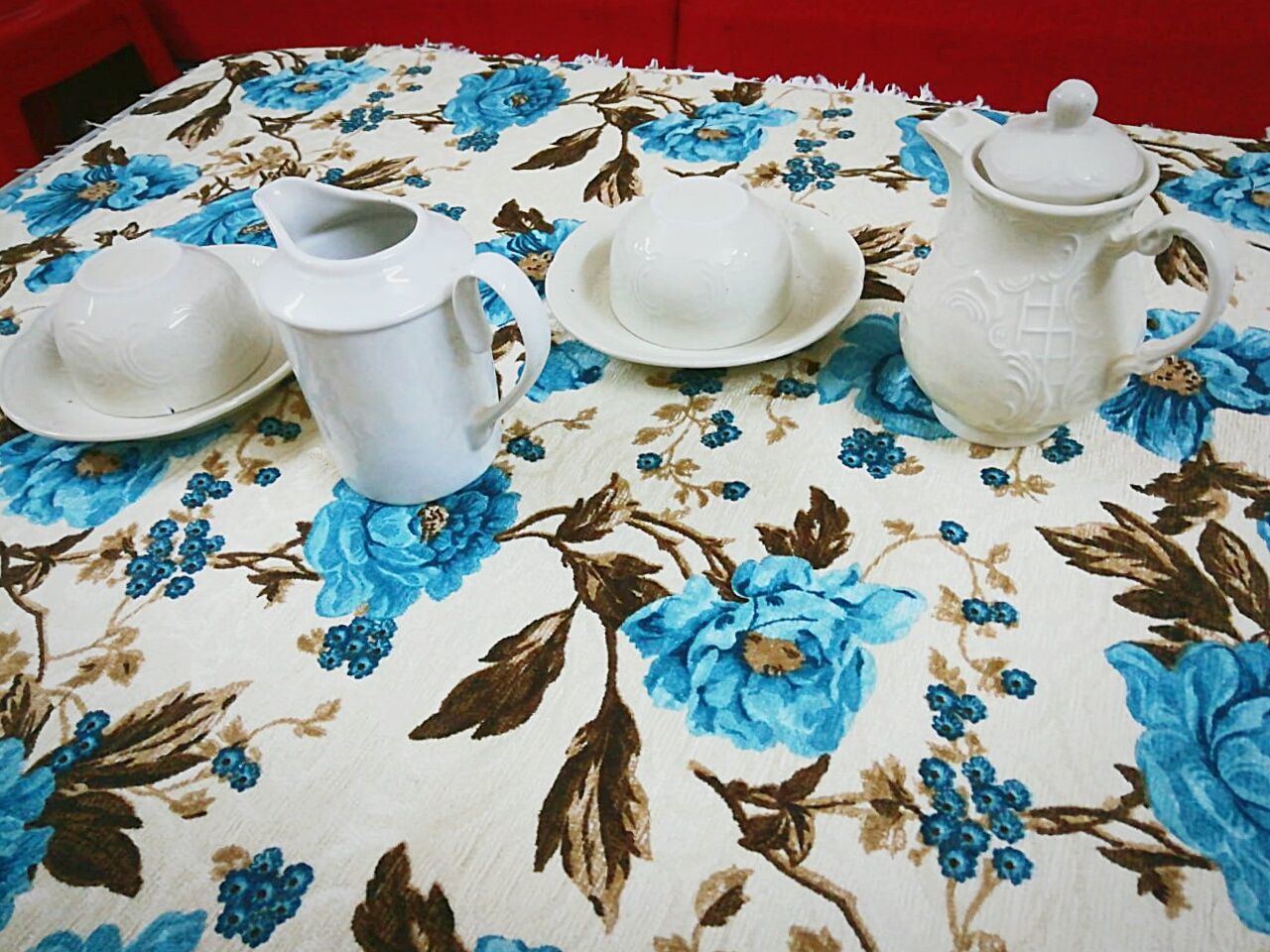 table, no people, indoors, still life, pattern, floral pattern, tablecloth, ceramics, choice, high angle view, variation, food and drink, plate, large group of objects, household equipment, porcelain, design, cup, white color, art and craft, crockery, teapot, tea cup
