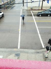 Man walking on road in city