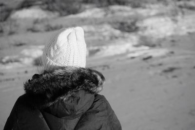 Rear view of woman looking at beach
