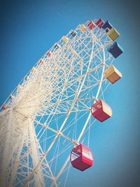 Low angle view of ferris wheel against sky