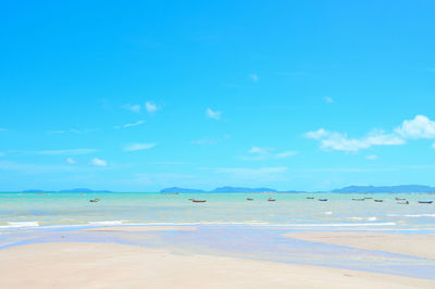 Scenic view of sea against blue sky