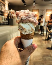 Hand holding ice cream cone