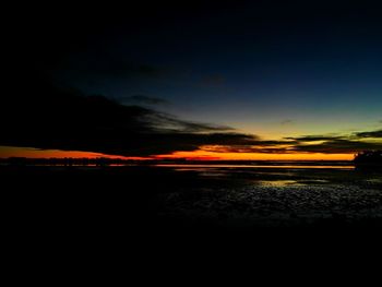 Scenic view of sea against romantic sky at sunset