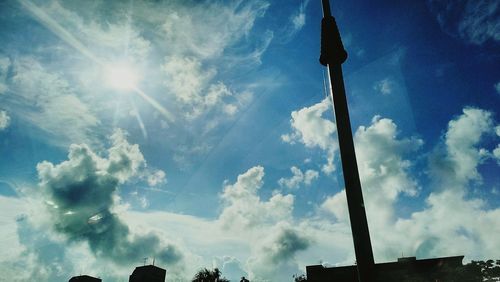 Low angle view of building against cloudy sky