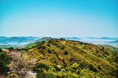 Scenic view of mountains against clear blue sky