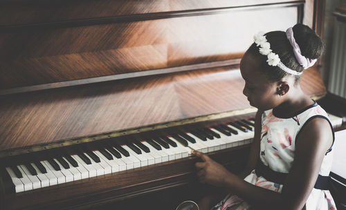 Close-up of girl at piano