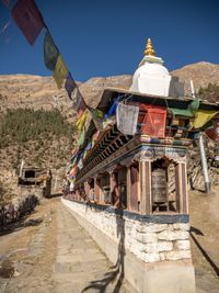 View of temple against building