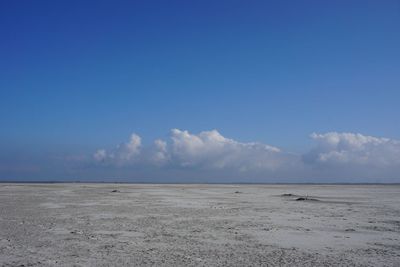 Scenic view of sea against blue sky