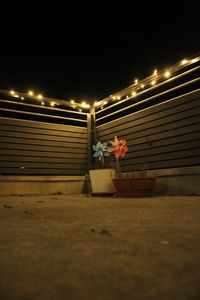 Man in illuminated built structure at night