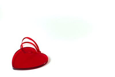Close-up of red shoes over white background