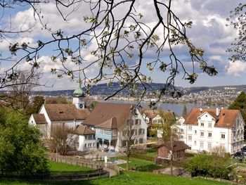 Residential buildings against cloudy sky