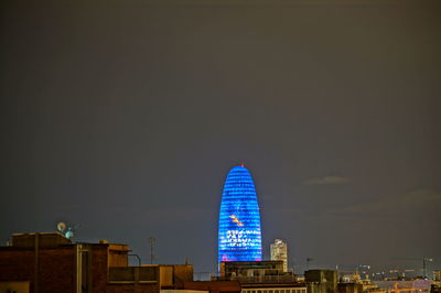 Modern buildings in city at night