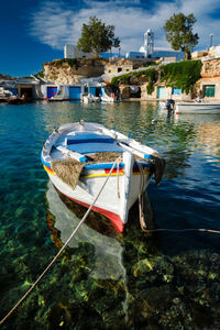 Boats in sea against sky