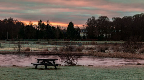 Scenic view of lake at sunset