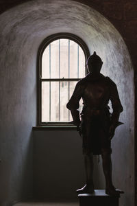 Woman walking in tunnel