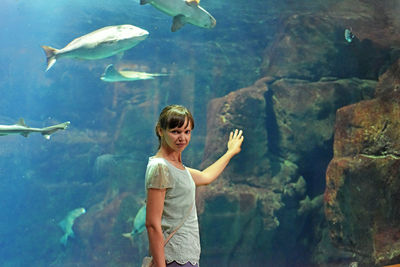 Boy swimming in sea at aquarium