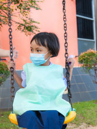 Asian girls wearing masks in school uniforms come out to do activities have fun playing 