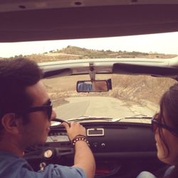 Rear view of woman driving car