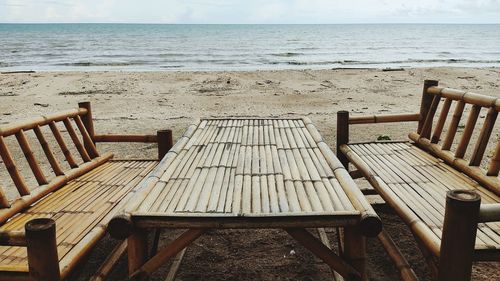 Empty chairs on beach