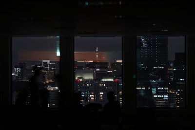 Illuminated buildings in city at night