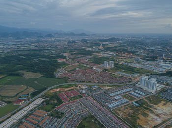 High angle view of buildings in city against sky