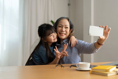 Portrait of smiling friends working at home