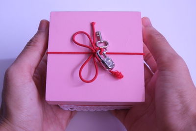 Close-up of woman hand over white background