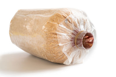 Close-up of bread on white background