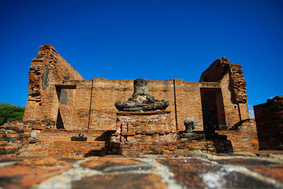 Old ruin building against blue sky