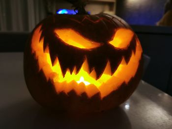 Close-up of illuminated pumpkin at home