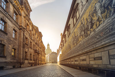 Street amidst buildings against sky in city