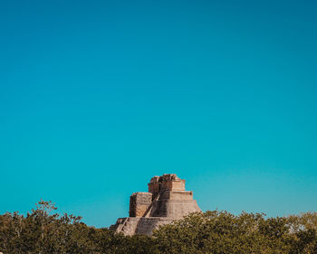 Low angle view of buildings against blue sky