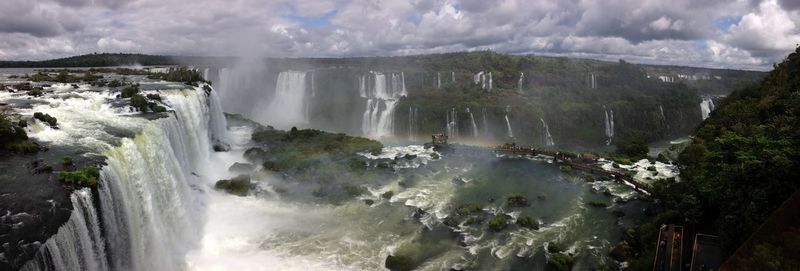 Panoramic view of waterfall against sky