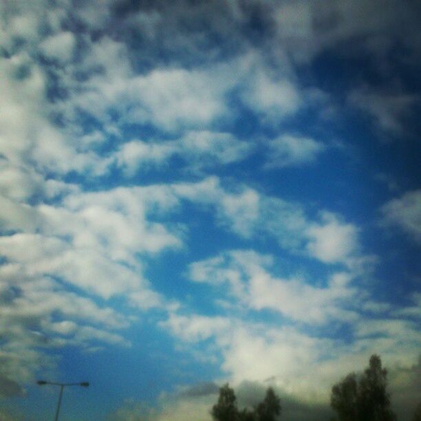 sky, low angle view, cloud - sky, cloudy, beauty in nature, tranquility, nature, scenics, tranquil scene, cloud, cloudscape, weather, outdoors, silhouette, no people, idyllic, day, blue, backgrounds, overcast