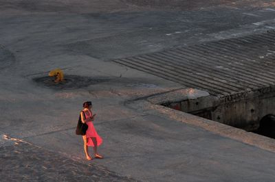 Women in red, on the pier