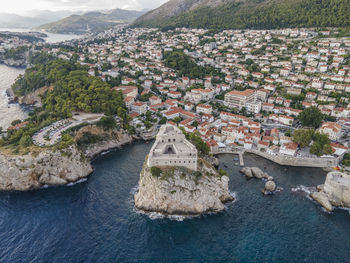 High angle view of river amidst buildings in town