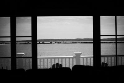 View of sea seen through window